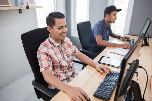 People working looking at their pc