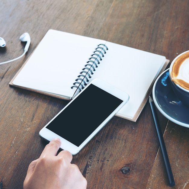 People working with phone and notebook