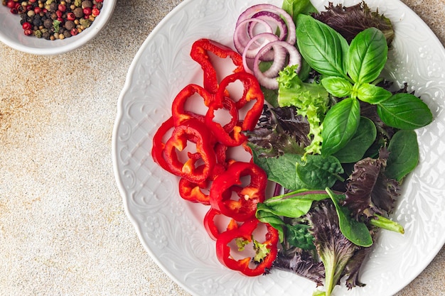 pepper paprika salad vegetable sweet green leaves fresh dish healthy meal food snack on the table