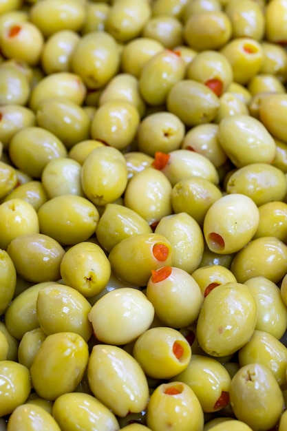 Pepper Stuffed Green Olives Close up Green olives as background texture