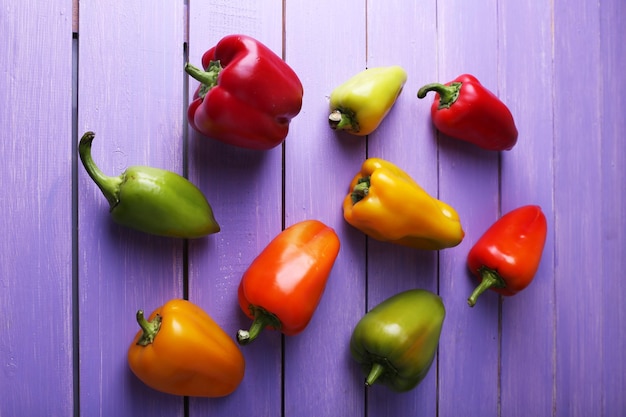 Pepper on wooden background