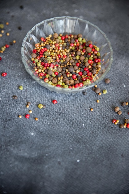 peppercorn 5 spices red, black, green and white pepper, coriander fresh food spice on the table