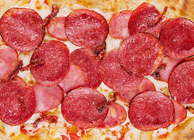 Photo pepperoni pizza close up background or texture