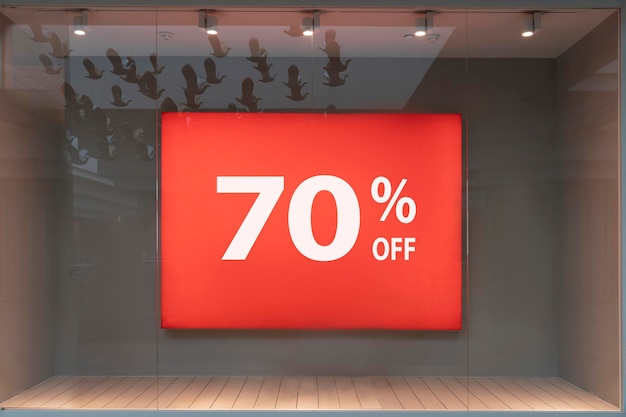 percent discount red billboard banner on sale shop window