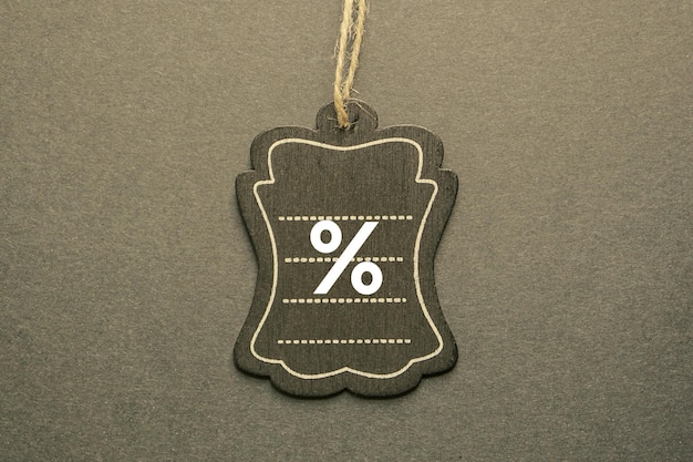 percent sign on the black price tag, black mockup background