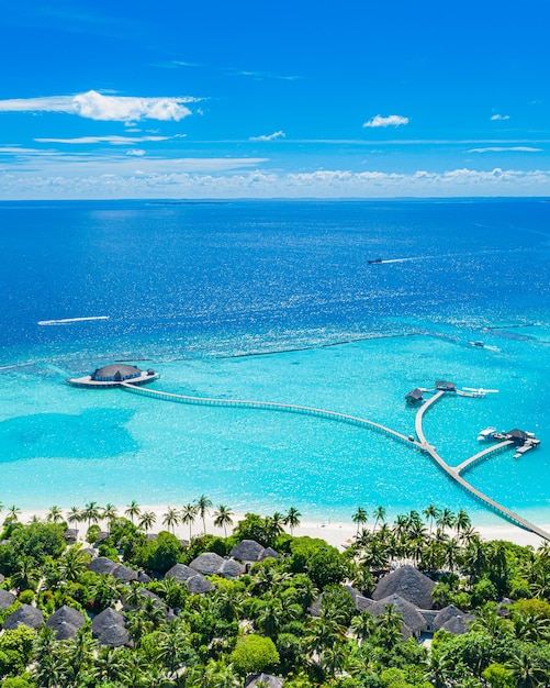 Perfect aerial landscape, luxury tropical resort, water villas bungalows, pristine beautiful beach