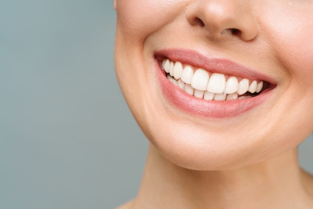 Perfect healthy teeth smile of a young woman teeth whitening dental care stomatology concept