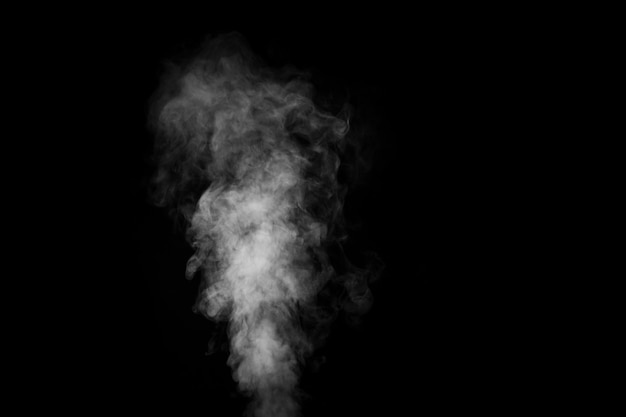 Perfect mystical curly white steam or smoke isolated on black background Abstract background fog or smog design element layout for collages