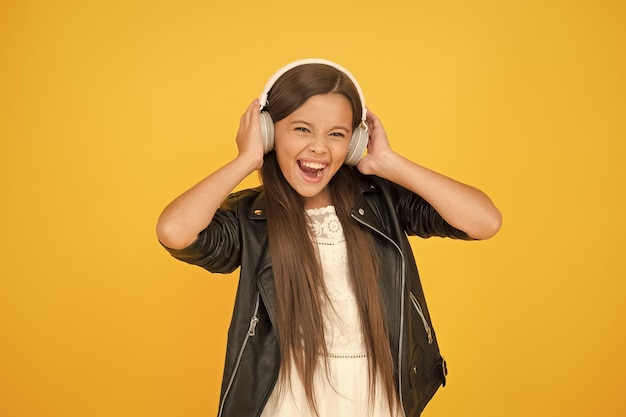 Perfect party small girl in leather jacket autumn fashion style child listen rock music little school radio dj lady DJ long hair happy smile hipster urban style girl biker kid in headset