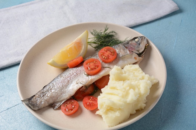 Perfectly baked oven trout with lemon and dill with cherry tomatoes olive oil lemon juice in foil