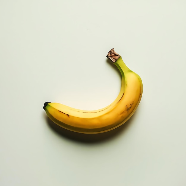 Photo a perfectly ripe banana isolated on a pristine white background