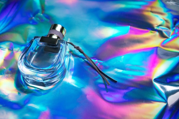 Perfume on a blue iridescent background