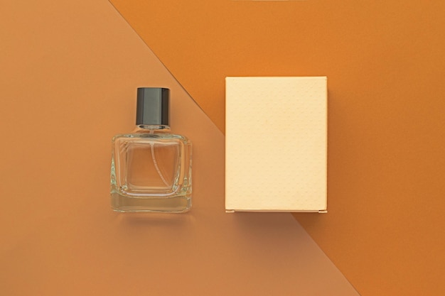 Photo perfume bottle and box mockup template on beige background