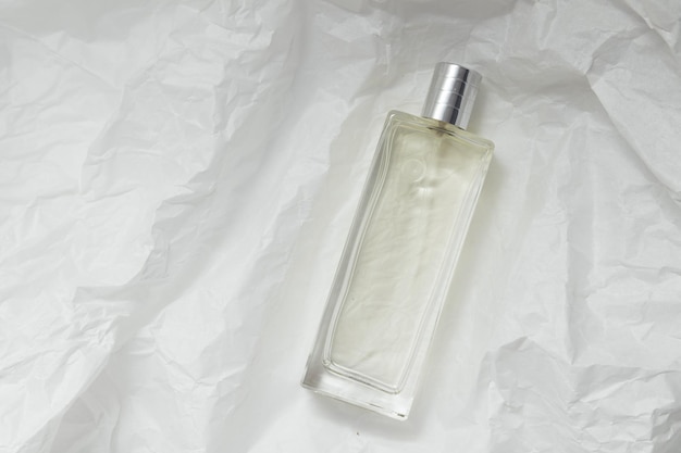 Perfume bottle fragrance spray mock up and white packaging paper