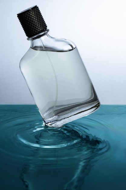 Perfume bottle over moving water Product photography