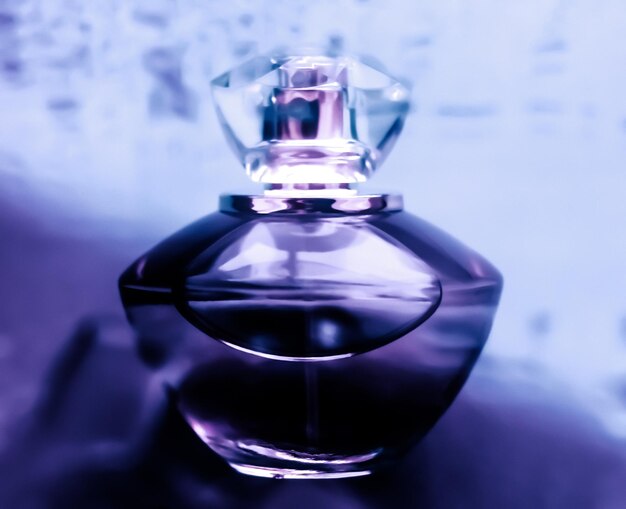 Perfume bottle under purple water fresh sea coastal scent as glamour fragrance and eau de parfum product as holiday gift luxury beauty spa brand present