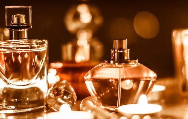 Perfume bottle and vintage fragrance on glamour vanity table at night pearls jewellery and eau de parfum as holiday gift luxury beauty brand present