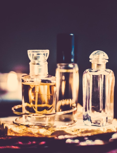 Perfume bottles and vintage fragrance at night aroma scent fragrant cosmetics and eau de toilette as luxury beauty brand holiday fashion parfum design