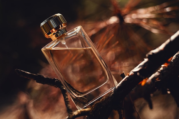 Perfume on brown autumn background