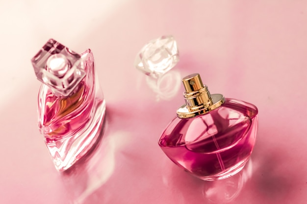 Perfumery spa and branding concept  pink perfume bottle on glossy background sweet floral scent glamour fragrance and eau de parfum as holiday gift and luxury beauty cosmetics brand design