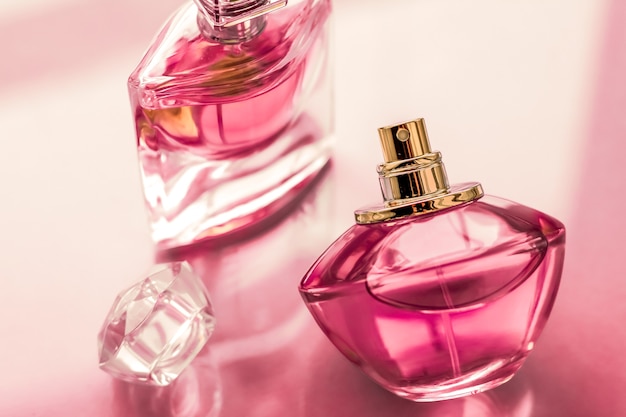 Perfumery spa and branding concept  pink perfume bottle on glossy sweet floral scent glamour fragrance and eau de parfum as holiday gift and luxury beauty cosmetics brand design