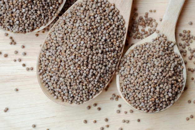 Perilla seeds in a wooden spoon are grains that can be eaten with both seeds and leaves.