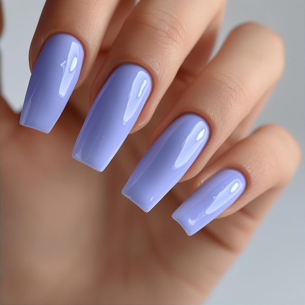 Periwinkle colored nail polish on manicured nails