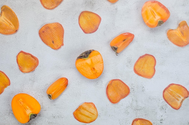 Persimmon with dried pineapple wedges