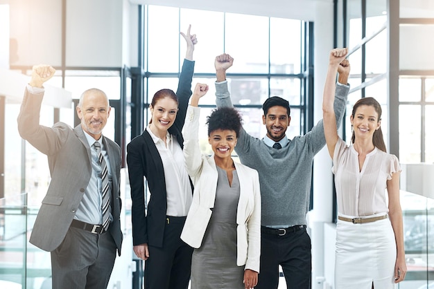 The persistent team is a profitable team Portrait of a diverse team of colleagues cheering you on at work