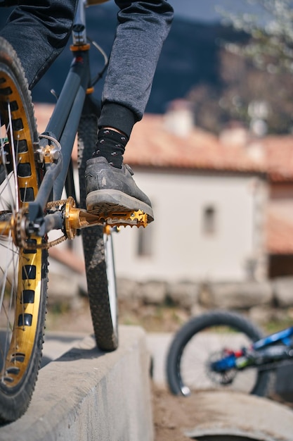 A person on a bike with a bike in the background