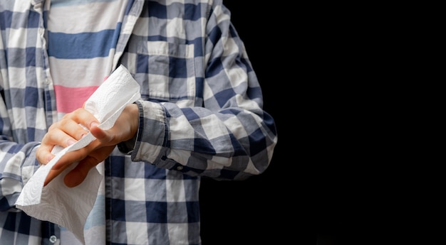 Person clean or wipe his hands with wet paper napkin