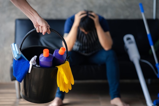 Person cleaning the room cleaning staff standing holding a bucket of cleaning equipment Cleaning staff Maintaining cleanliness in the organization