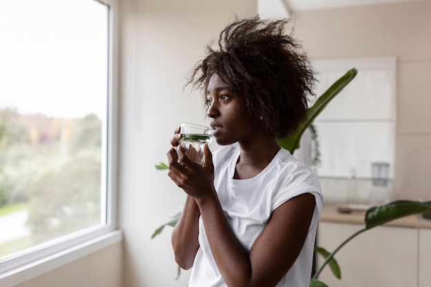 Person drinking water to be hydrated