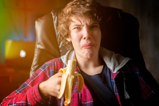 Person eat fresh banana with emotions on face b