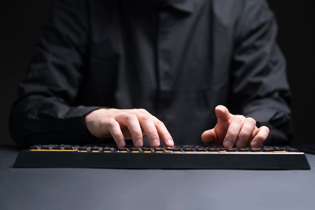 A person on his work place typing on the keyboard