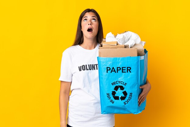 Person holding a bag to recycle