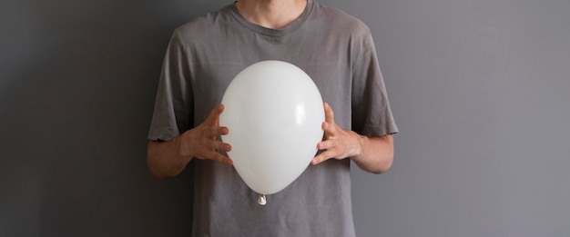 A person holding balloon happy holidays celebration