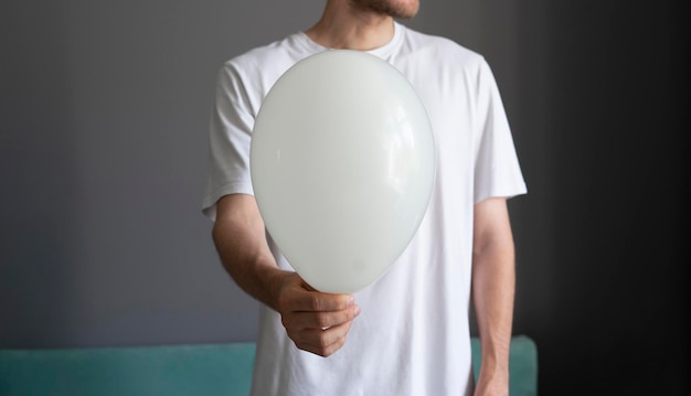 A person holding balloon happy holidays celebration