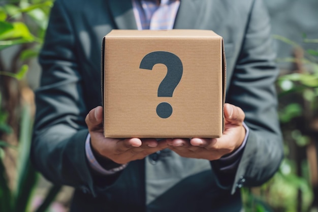 a person holding a box with a question mark