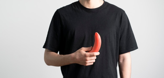 A person holding fresh raw red banana healthy eating