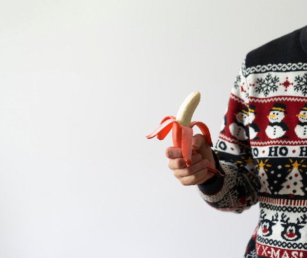 A person holding fresh raw red banana healthy eating