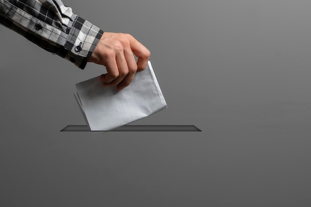 A person holding a paper bulletin and drop it in the urn minimalistic vote concept