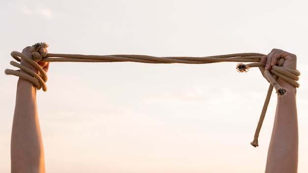 Person holding a rope tight