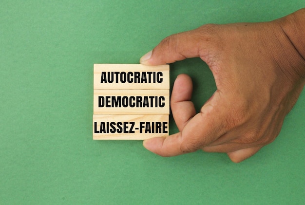 a person holding a stick with the word autoe on it