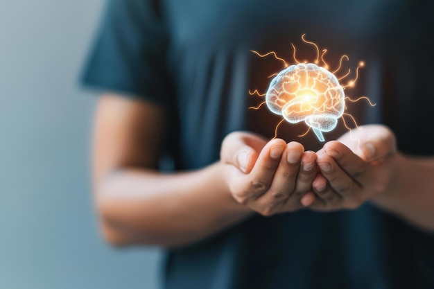 Person holding a virtual brain glowing with energy symbolizing innovation technology