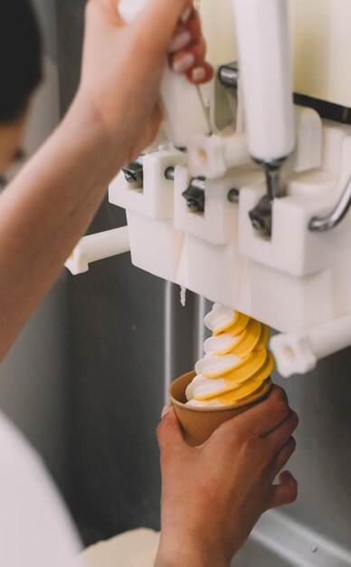 a person is pouring water into a banana peel