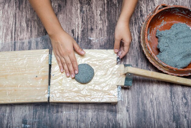 Person making corn tortillas at home