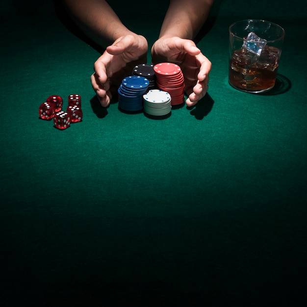 A person playing poker in casino