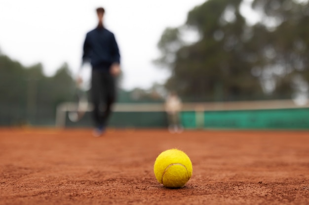 Person playing tennis game in winter time