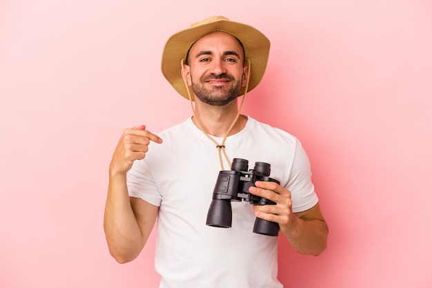 Person pointing by hand to a shirt copy space proud and confident